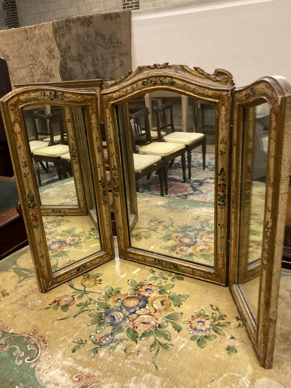 An early 20th century Venetian style rectangular floral painted serpentine table with similar triple dressing table and a low occasiona